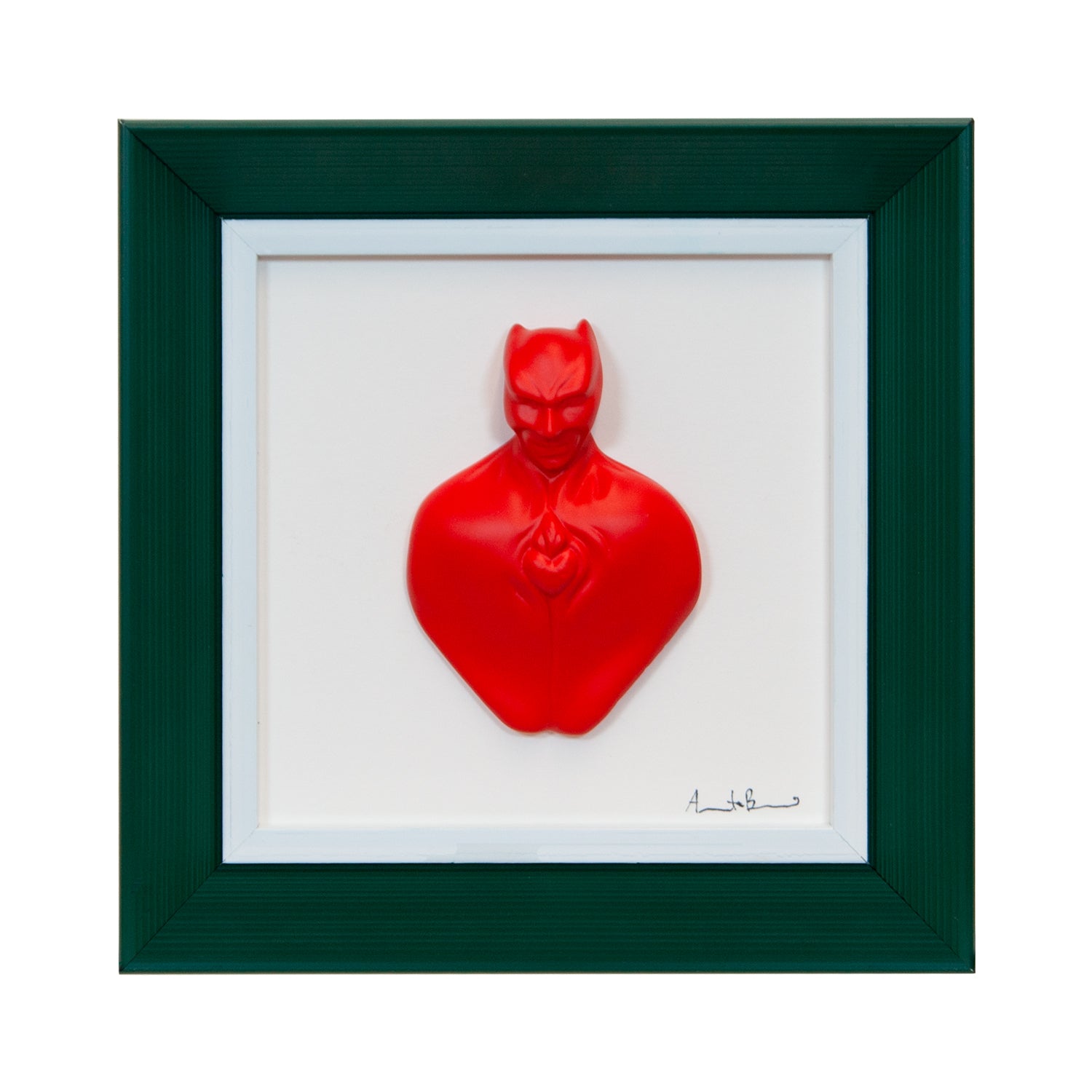 Man in color-scultura in resina opaca rossa con cornice verde scuro in quadro fondo bianco