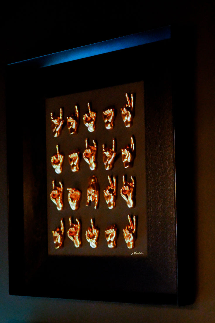 Multimani - sculptures in shiny bronze resin on a black background frame with an Italian handcrafted frame